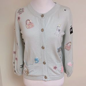 Very rare & highly desirable Chanel cashmere sweater with exquisite icons.
